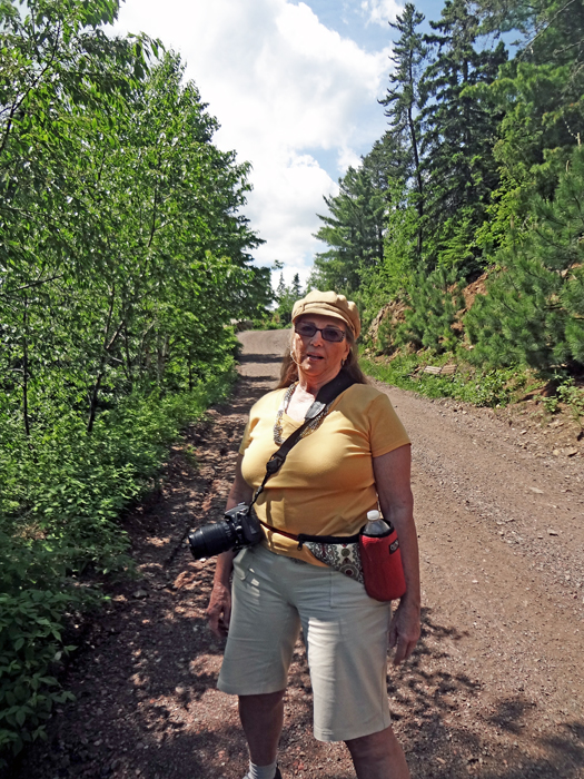 Karen Duquette is exhausted after walking half way up the hill